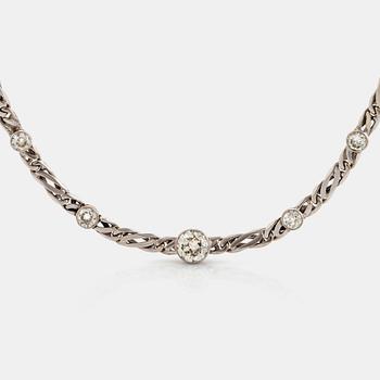 988. An 18K white gold necklace/bracelet combination set with round brilliant-cut diamonds.
