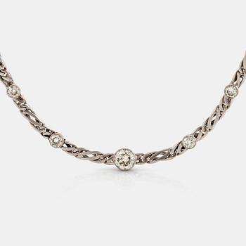 988. An 18K white gold necklace/bracelet combination set with round brilliant-cut diamonds.