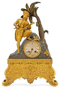 641. A French 1830/40's century gilt and patinated bronze mantel clock.