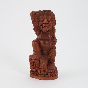 A carved wooden figure of a beast, Southeast asia, first half of the 20th Century.