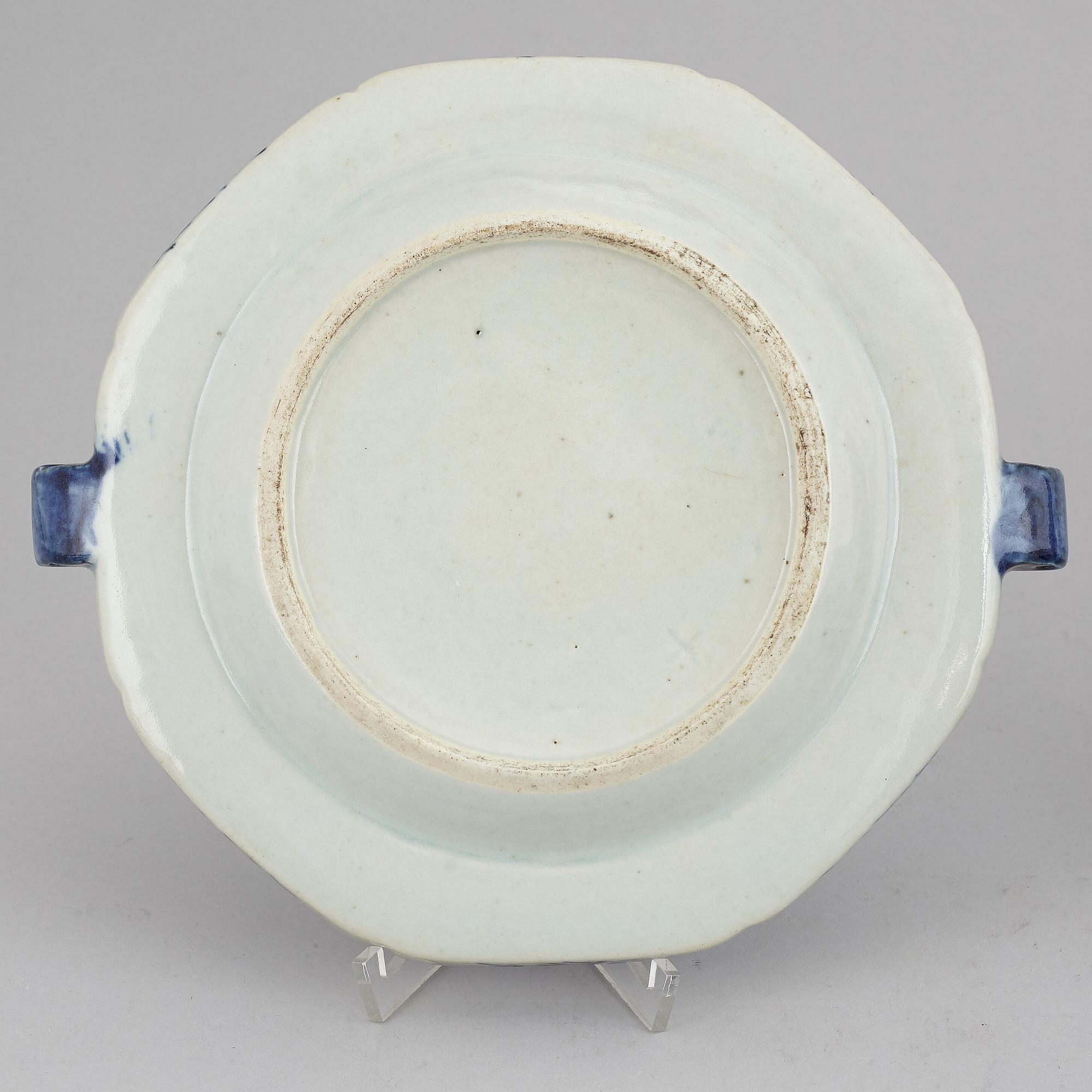A set of three blue and white plates and a hot water dish, Qing dynasty, 18th/19th Century.