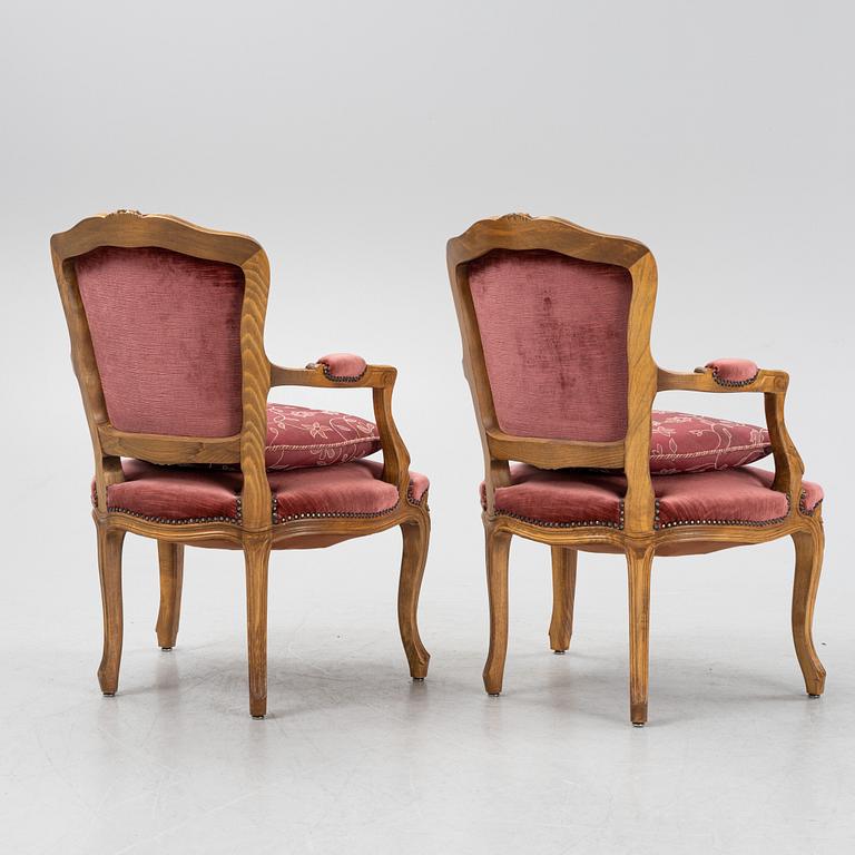A pair of rococo style armchairs, 20th Century.