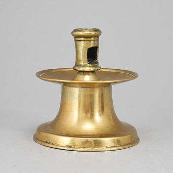 A capstan candlestick, brass, probably 16th or 17th century.