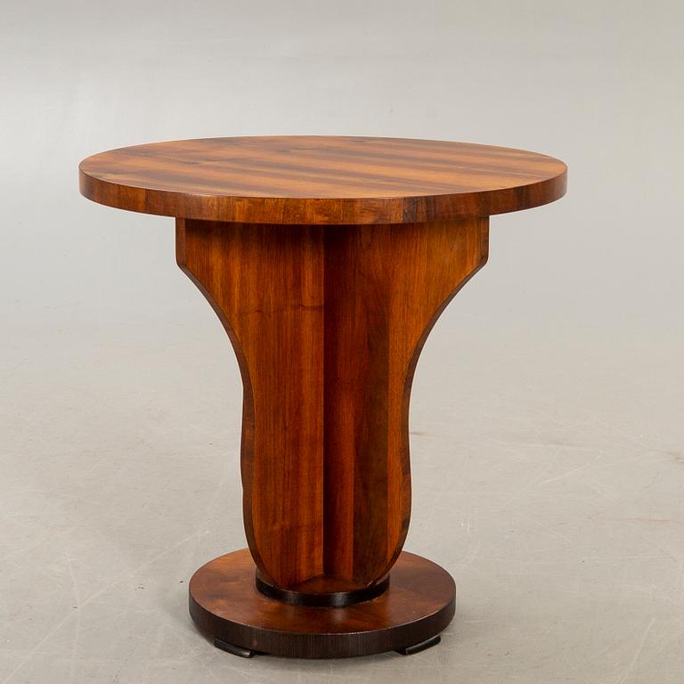 An Art deco style walnut table later part of the 20th century.