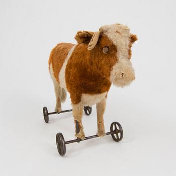 A Steiff cow and a Schuco "Tricky", Germany, 1910 and 1930/40s.
