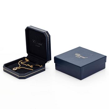 Chopard, an 18K gold 'Happy Diamonds' necklace with brilliant-cut diamonds.
