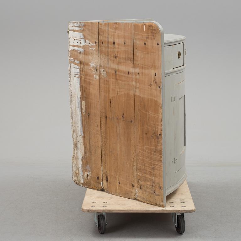 A mid 19th century corner sideboard.