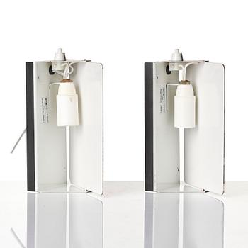 Charlotte Perriand, a pair of wall lights model "CP1", La Société Centrale d'Eclairage, France, 1960s.