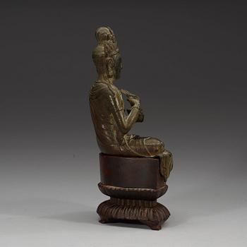 A seated bronze figure of Guanyin, Ming dynasty (1368-1644).