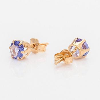 A pair of 14K gold earrings with tanzanites.