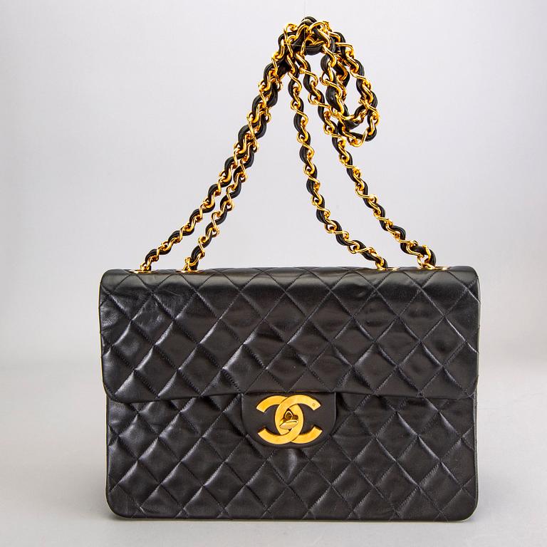 A Chanel maxi jumbo leather bag.