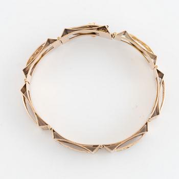 Gold panel bracelet.