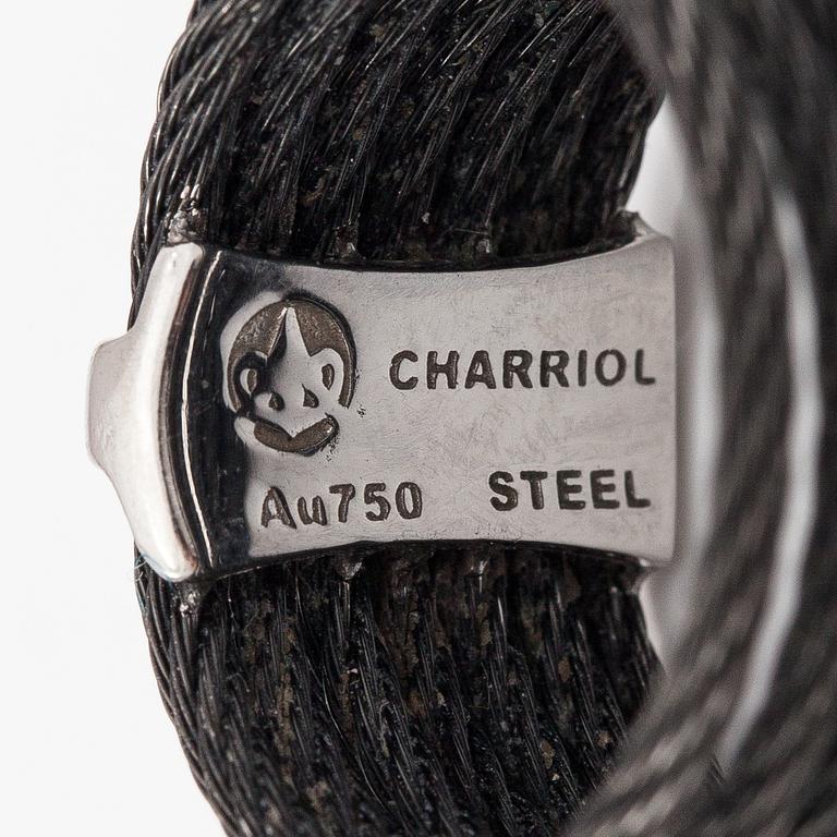 An 18K white gold and steel ring with diamonds ca. 0.095 ct in total. Charriol.