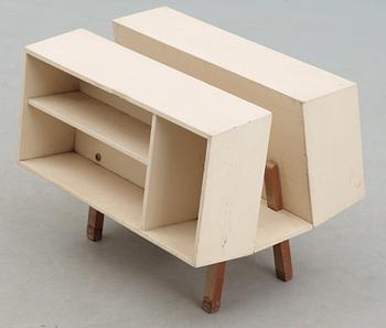 An Ernest Race white lacquered plywood and teak 'Penguin Donkey Mark II', bookcase, Isokon, England probably 1960's.