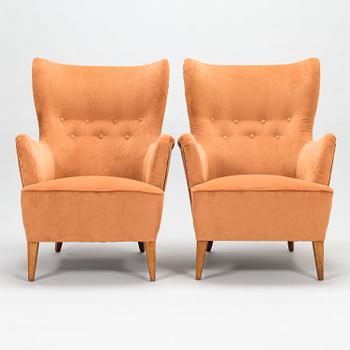 A pair of 1950's open arm chairs for Oy Paul Boman Ab.