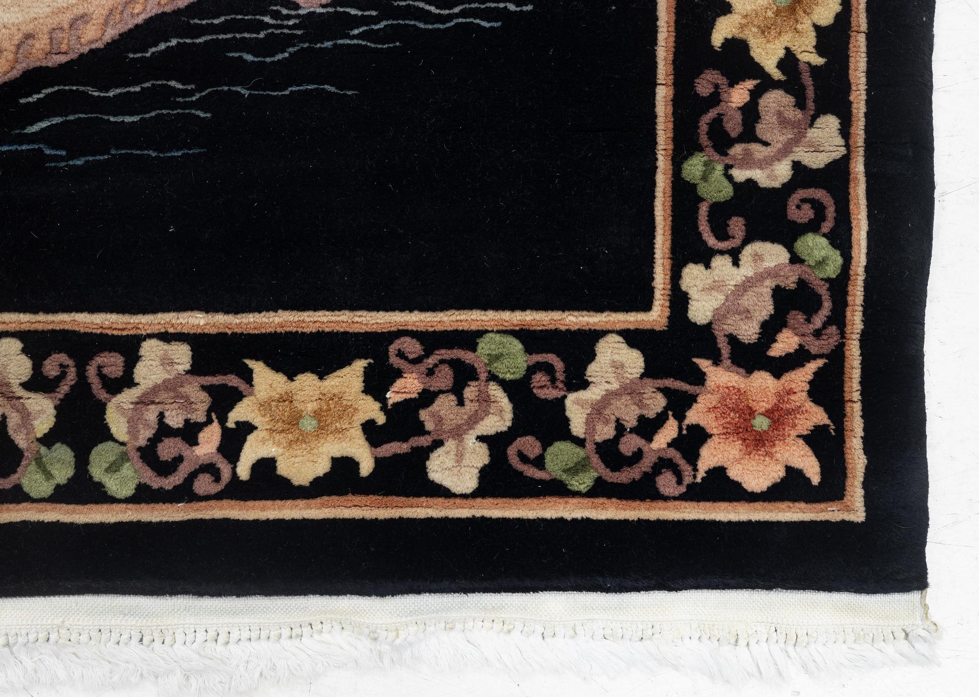 A Chinese rug, c. 183 x 120 cm.