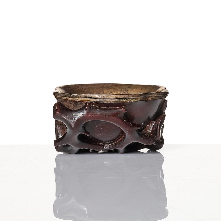 A sculptured wooden cup with silvered liner, Qing dynasty.