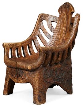 709. A Gustaf Fjaestad art noveau sculptured pine armchair, Sweden 1894.