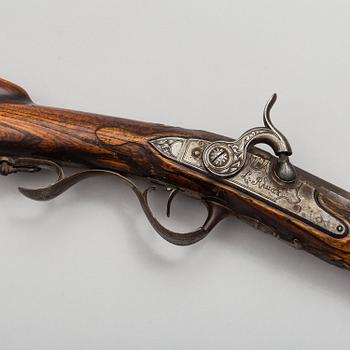 a 18th century rifle later made in to a percussion rifle signed by Lars Rånge, Jönköping.