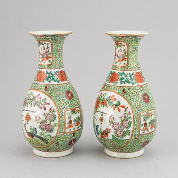 A pair of famille rose canton vases, early 20th century.