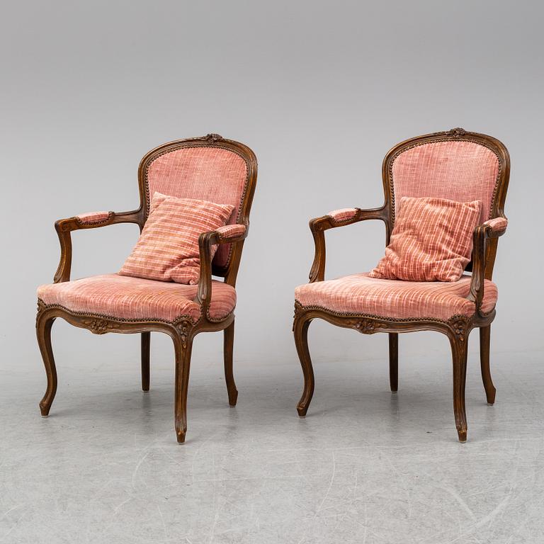 A pair of 19th-century rococo revival arm-chairs.