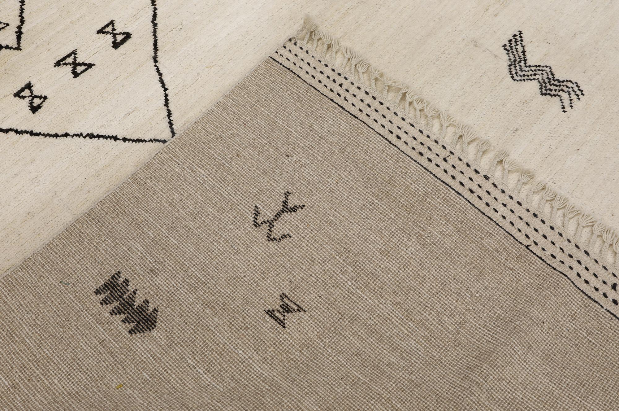 A Moroccan design carpet, c. 306 x 201 cm.