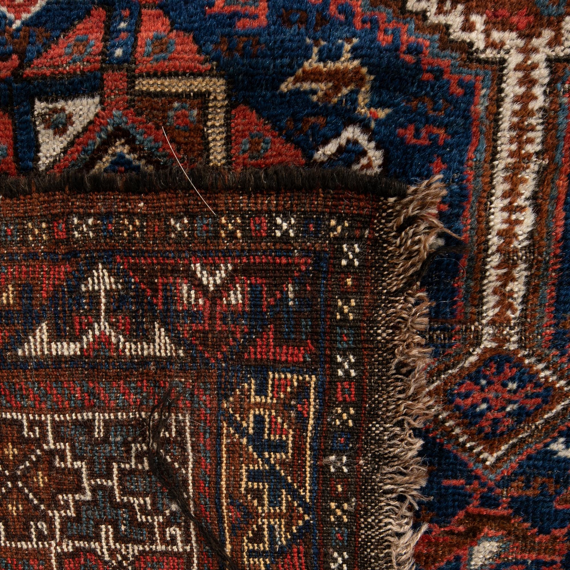 Antique Kamseh carpet, approximately 275x210 cm.