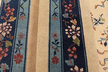 A semi-antique carpet, China, ca 360 x 272 cm.