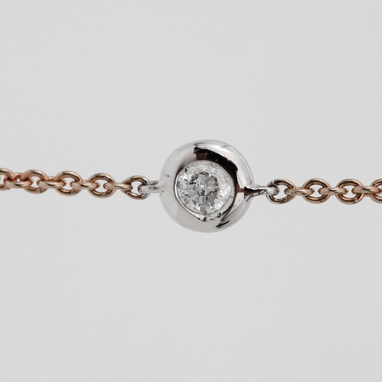 NECKLACE, a 90cm gold chain with 23 diamonds. total 1ct.