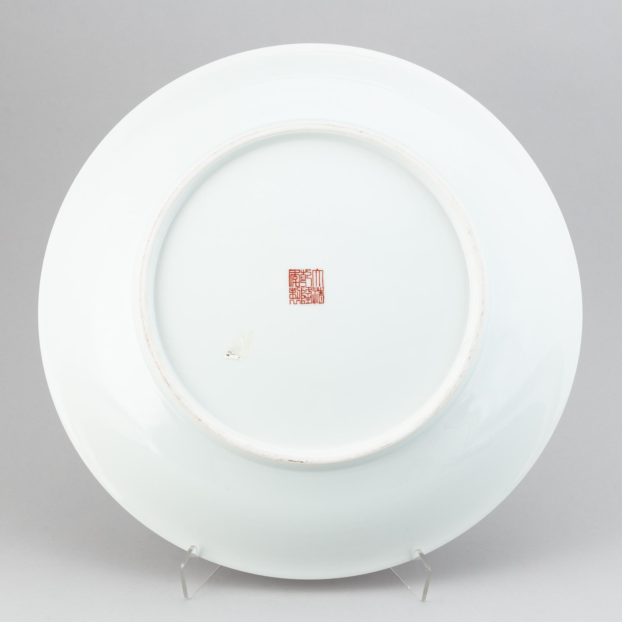 A large Chinese dish with a fierce five clawed dragon, modern.