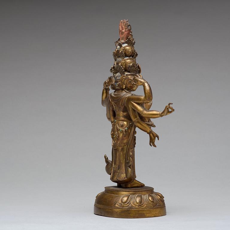 A Tibeto-Chinese gilt bronze figure of eleven-headed Avalokiteshvara, 19th Century.