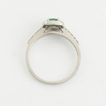 Emerald and brilliant-cut diamond ring.