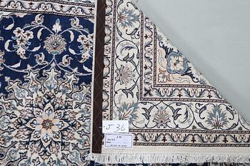 A carpet, Nain, part silk, ca 205 x  152 cm.