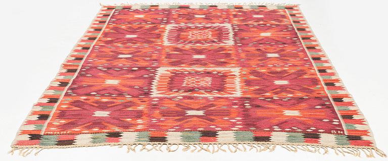 Barbro Nilsson, a carpet, 'Nejlikan röd', tapestry weave, c 331 x 214 cm, signed AB MMF BN.