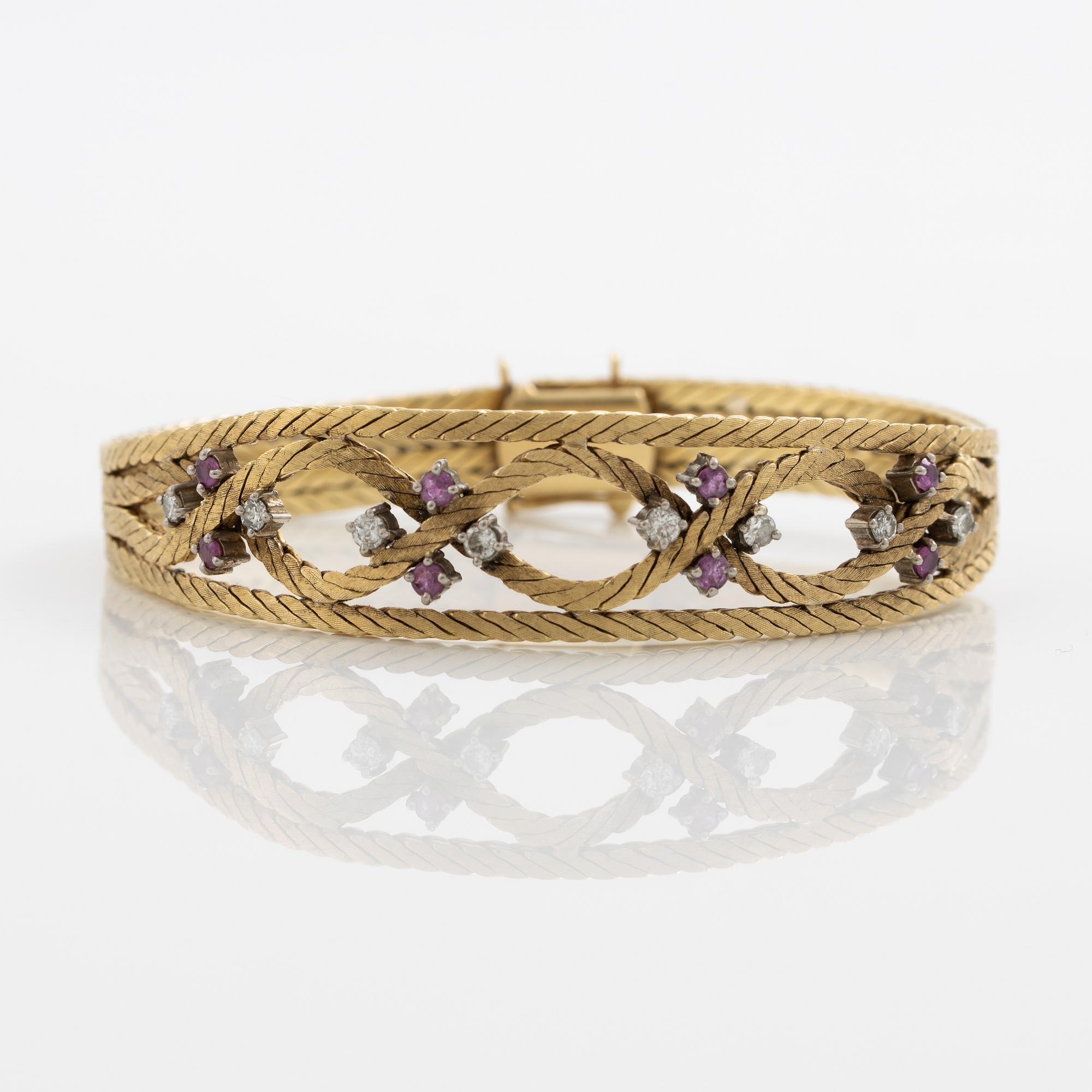 Bracelet 18K gold with diamonds and rubies.