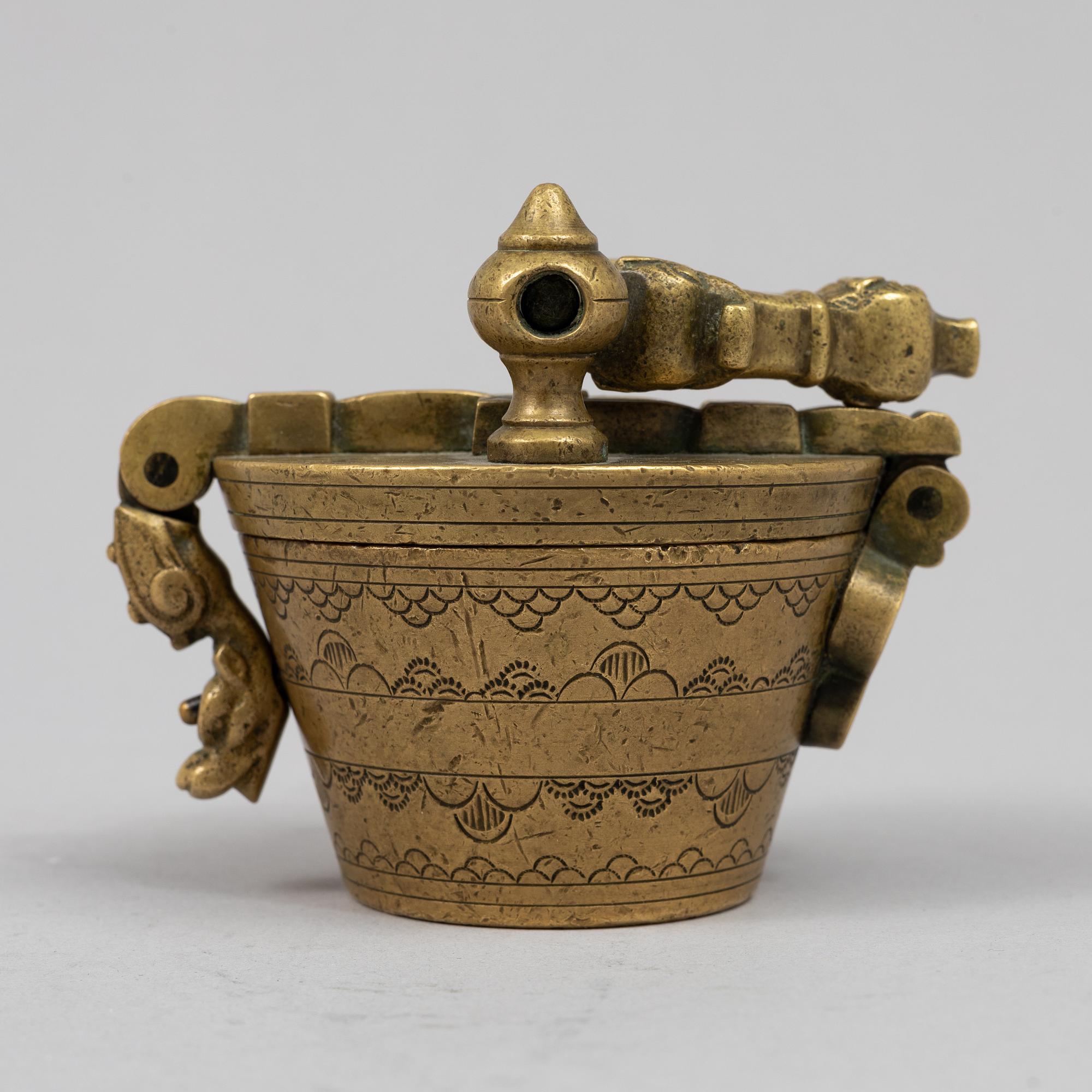 A brass weight set, late 19th century.