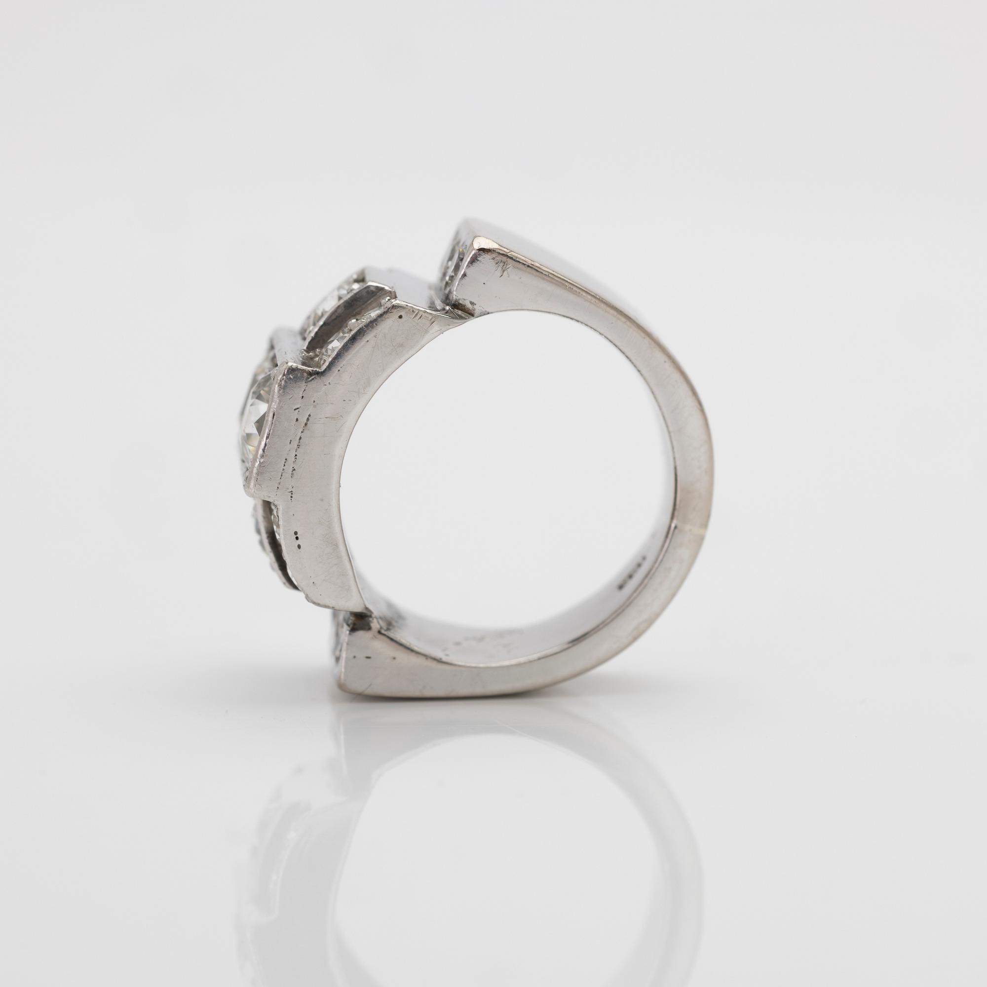 18K white gold ring with diamonds.