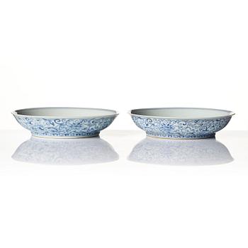 A pair of blue and white 'Phoenix' dishes, Qing dynasty, Daoguang mark and of the period (1821-50).