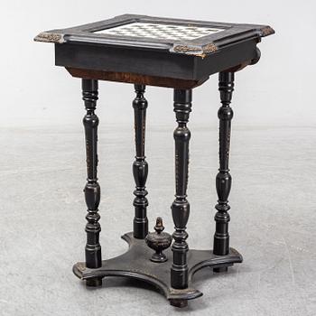 A porcelain and wooden mounted chess table, late 19th century.