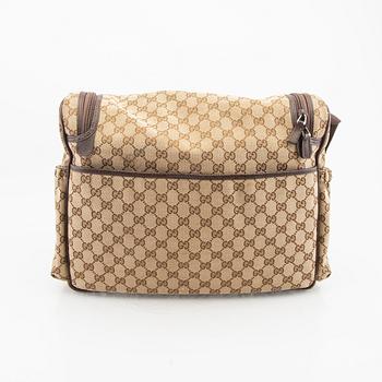 A Gucci diaper bag.