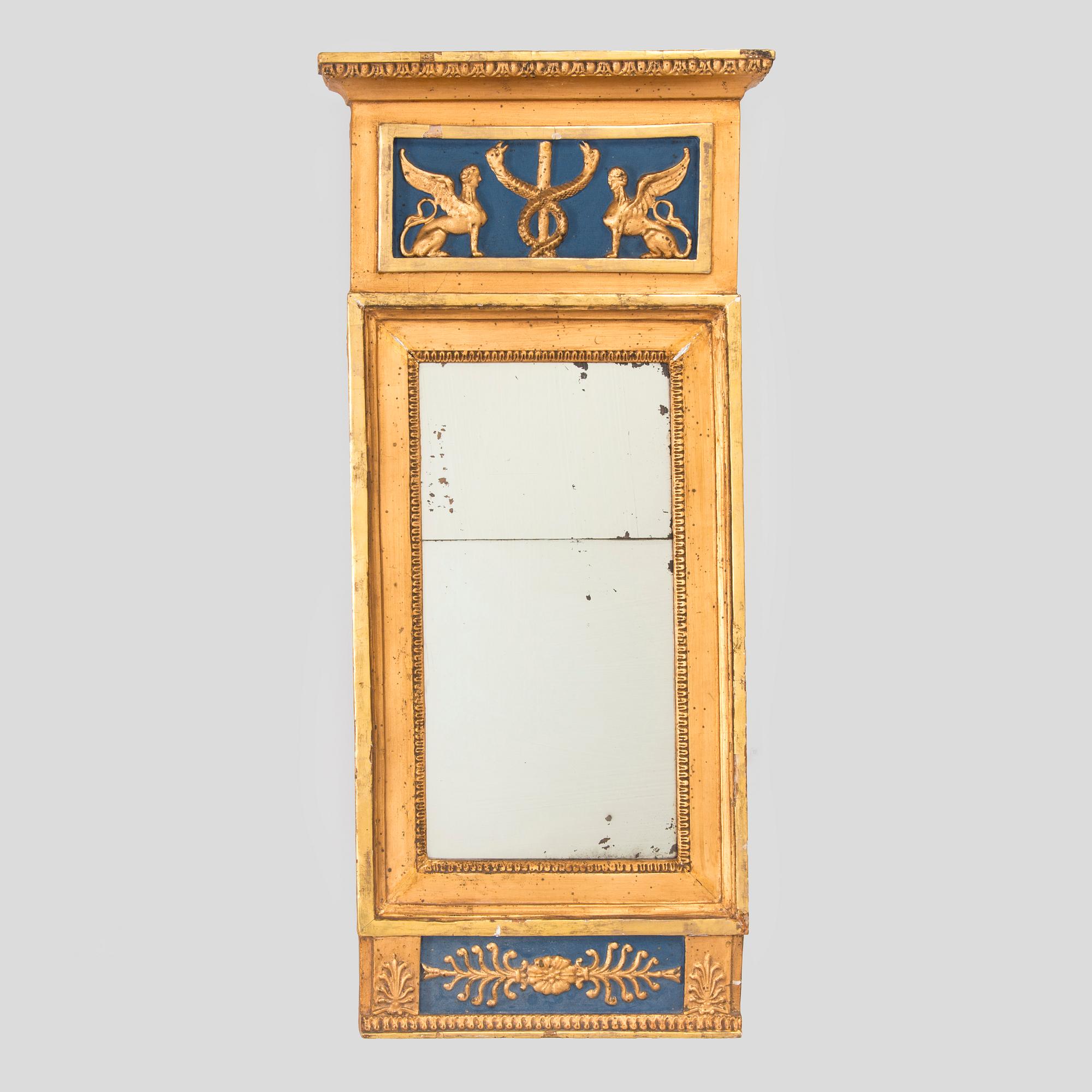 A gilded and bronzed Empire mirror, first half of the 19th century.