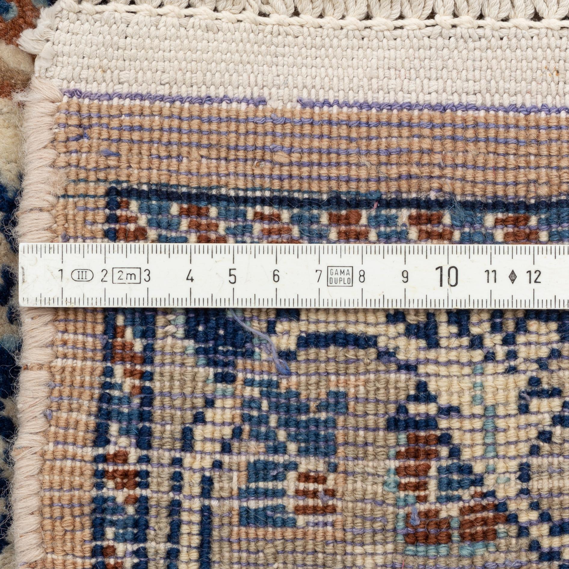 A carpet, possibly Yasd, c. 459 x 309 cm.