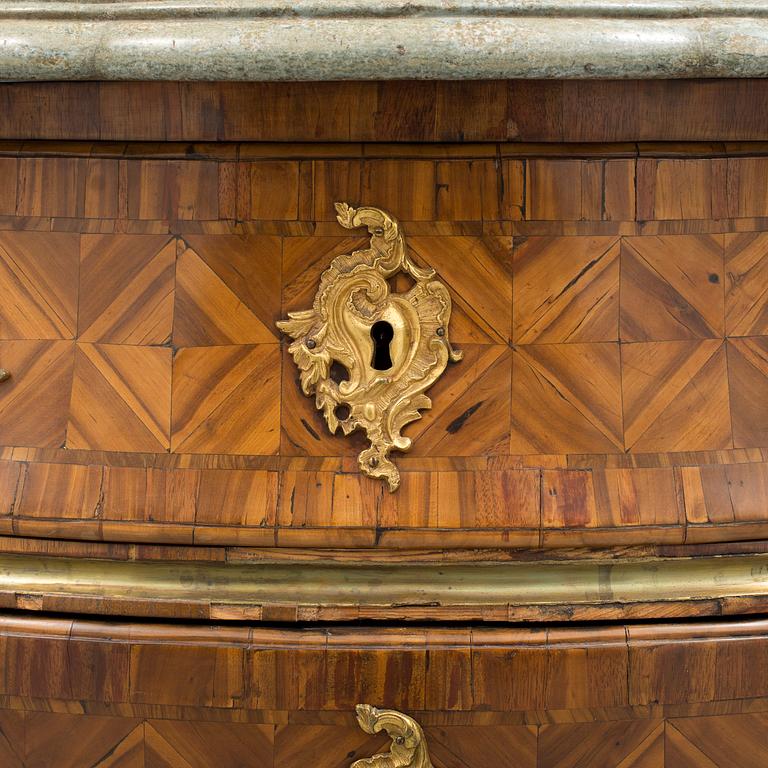 A 1700s rococo commode.