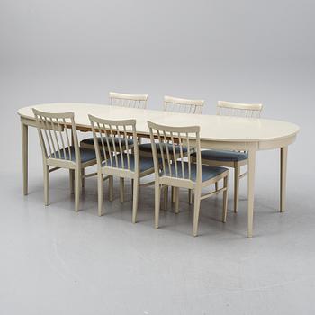 A dining table with six chairs by Carl Malmsten, second half of the 20th Century.