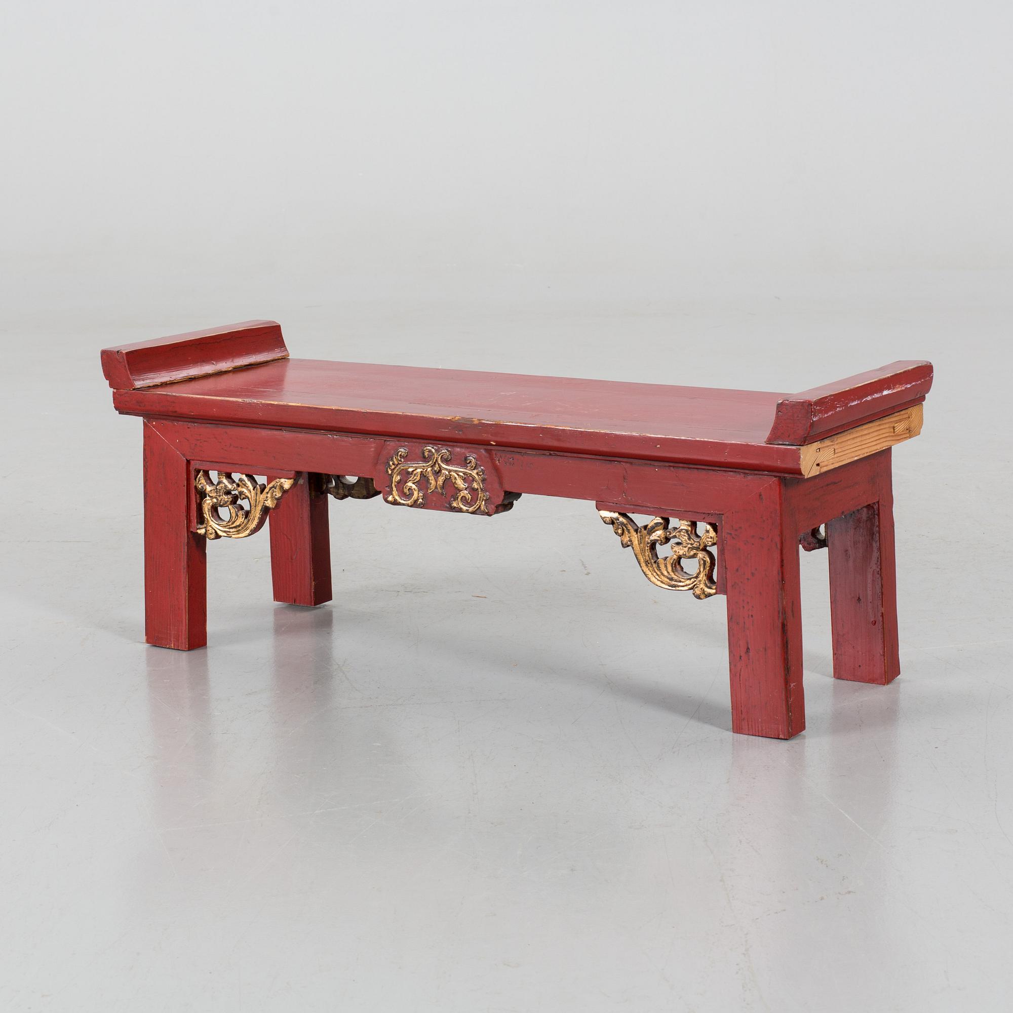 A Chinese 20th century painted wooden bench.