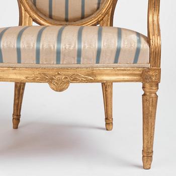 A pair of Gustavian giltwood open armchairs, late 18th century.