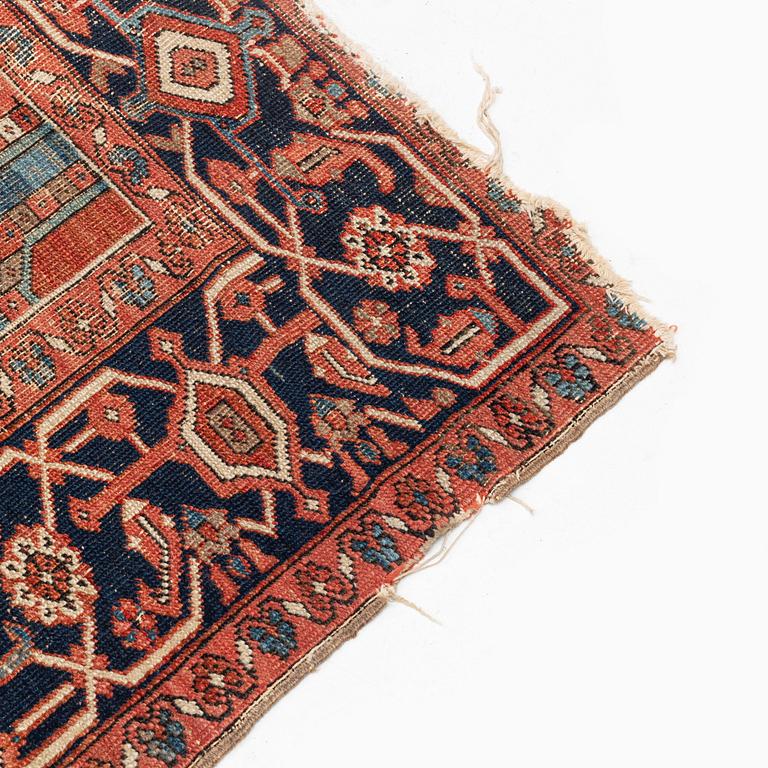 An antique Heriz carpet, ca 350 x 317 cm.