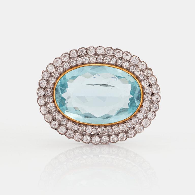 A BROOCH set with an aquamarine and old-cut diamonds.