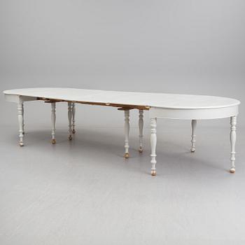 A mid 19th century dining table with six extension leaves.