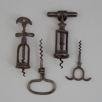 FOUR CAST IRON CORK SCREWS, 19th century.